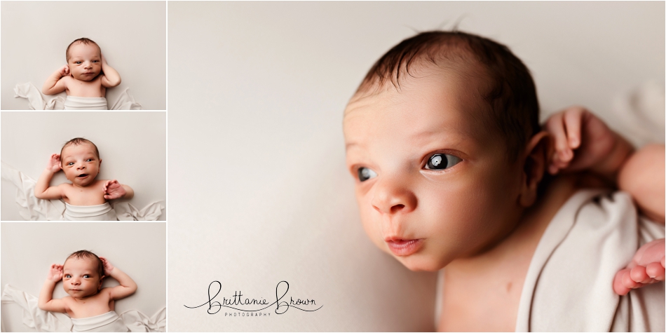 Bright-eyed baby Phoenix showing off his curious expressions during his milestone session.