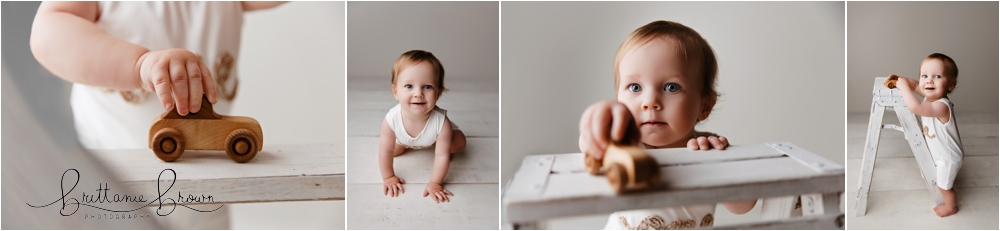 Bennett wearing a “one” outfit on a white backdrop, making funny faces during his birthday session.