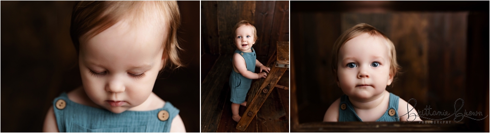 Sibling portrait on a dark wood backdrop featuring Bennett.