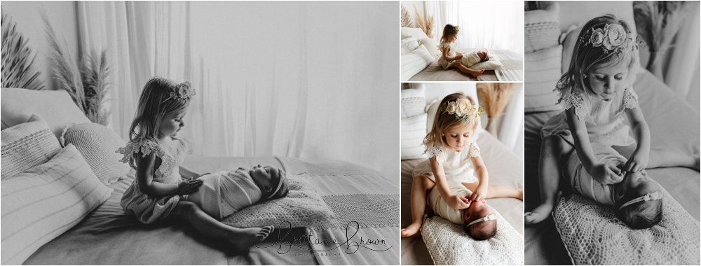 Newborn Sibling Session in Georgetown KY snuggling on a bed in a beautiful studio.