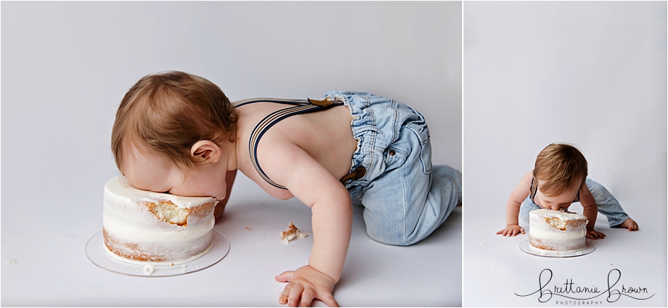 Baby on all 4's bending over to eat his birthday cake at a Georgetown, KY studio for his cake smash photography session.