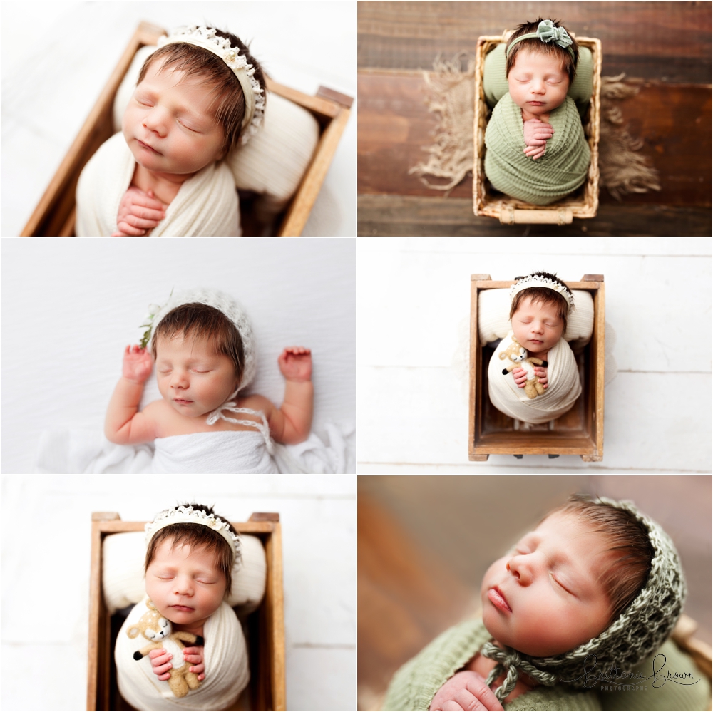 Baby with a lot of dark brown hair, wrapped and in a prop. 