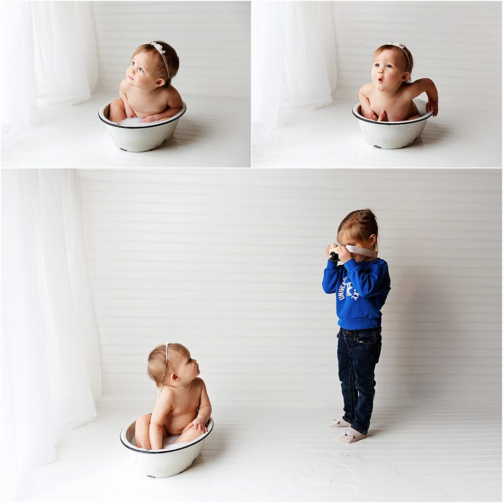 Baby splashing in a milk bath during her one-year photoshoot