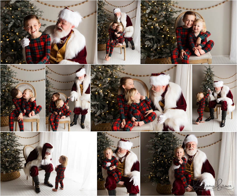 Siblings sitting on santas lab next to a Christmas Tree.