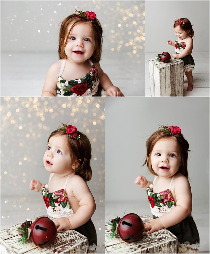 Baby Cecilia in an adorable Christmas outfit surrounded by twinkling holiday lights for her one-year milestone session.