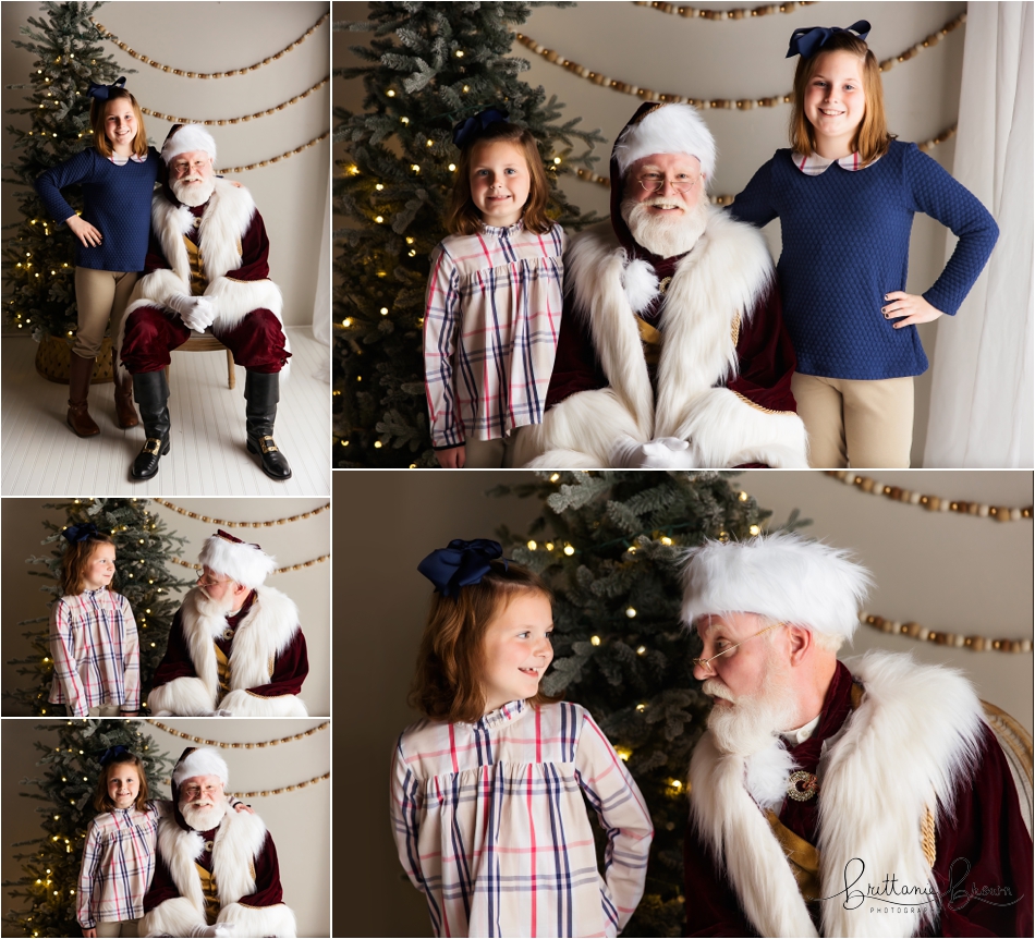 A family sharing a laugh with Santa in the studio.