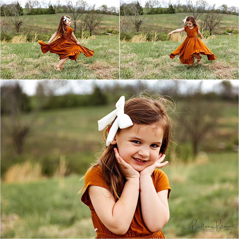 Little girl twirling in a field during an outdoor family session in Georgetown, KY.