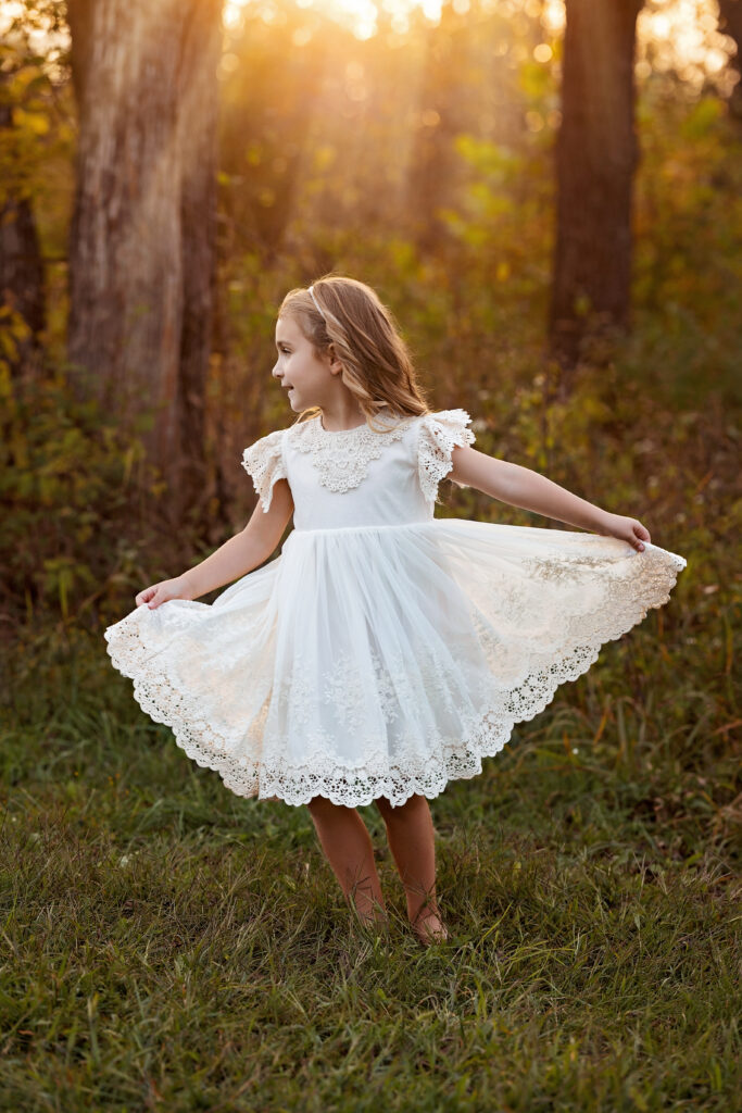 Golden hour in Georgetown, KY little girl spinning in the sunlight
